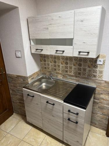 Mosoly-Apartman- Csaladi-szoba-konyha